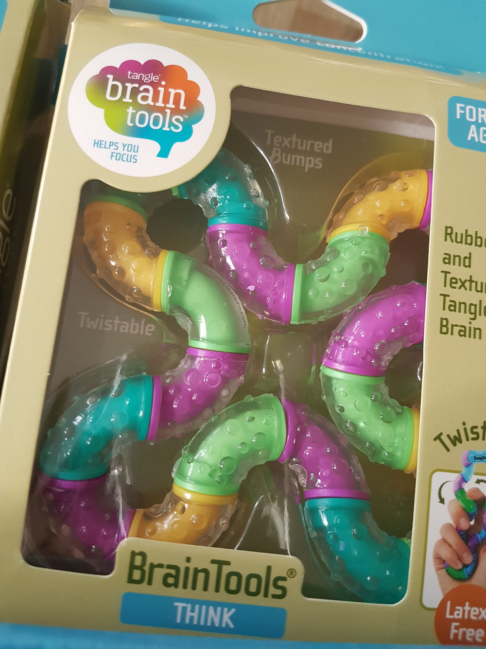 Grote brain tools think tangle fidget, paars, groen en geel in verpakking